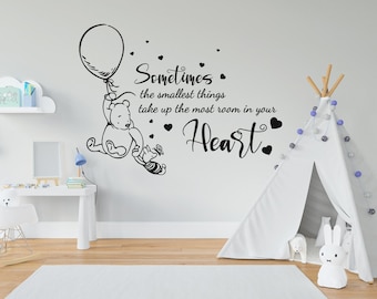 May include: Black and white Winnie the Pooh wall decal with the quote "Sometimes the smallest things take up the most room in your heart."