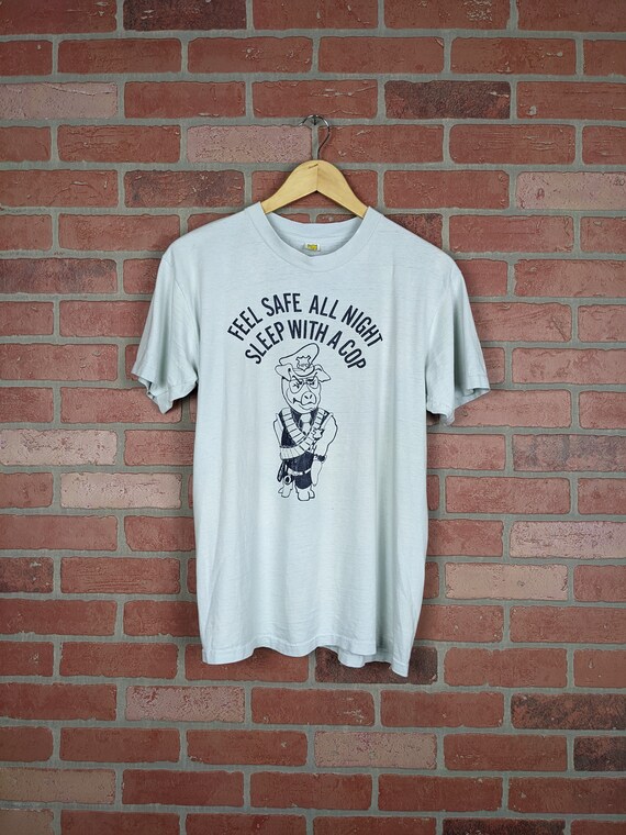 Premium Vector | Feel save tonight sleep with a police cop tshirt design