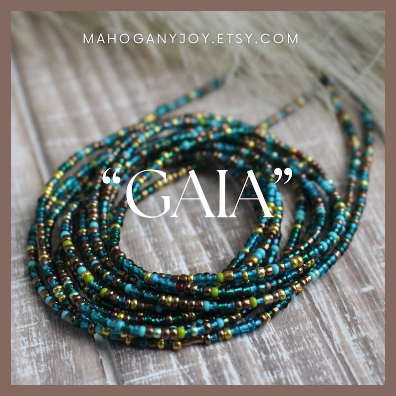May include: A collection of beaded waist beads in shades of teal, gold, and brown. The beads are arranged in a circular pattern, with the word "GAIA" in white text. The Etsy shop name "MAHOGANYJOY.ETSY.COM" is at the top.