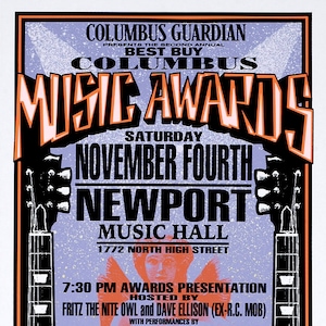 May include: A poster advertising the second annual Columbus Music Awards, taking place on Saturday, November 4th at the Newport Music Hall. The poster features two electric guitars, the text "Best Buy Columbus Music Awards", and a list of performers including Hank Marr, One Riot One Ranger, Black Swamp Saxophone Quartet, Phil Shipley, Freedom, Ekoostik Hookah, Mary Adam 12, New Identity, and Th' Flyin' Saucers.