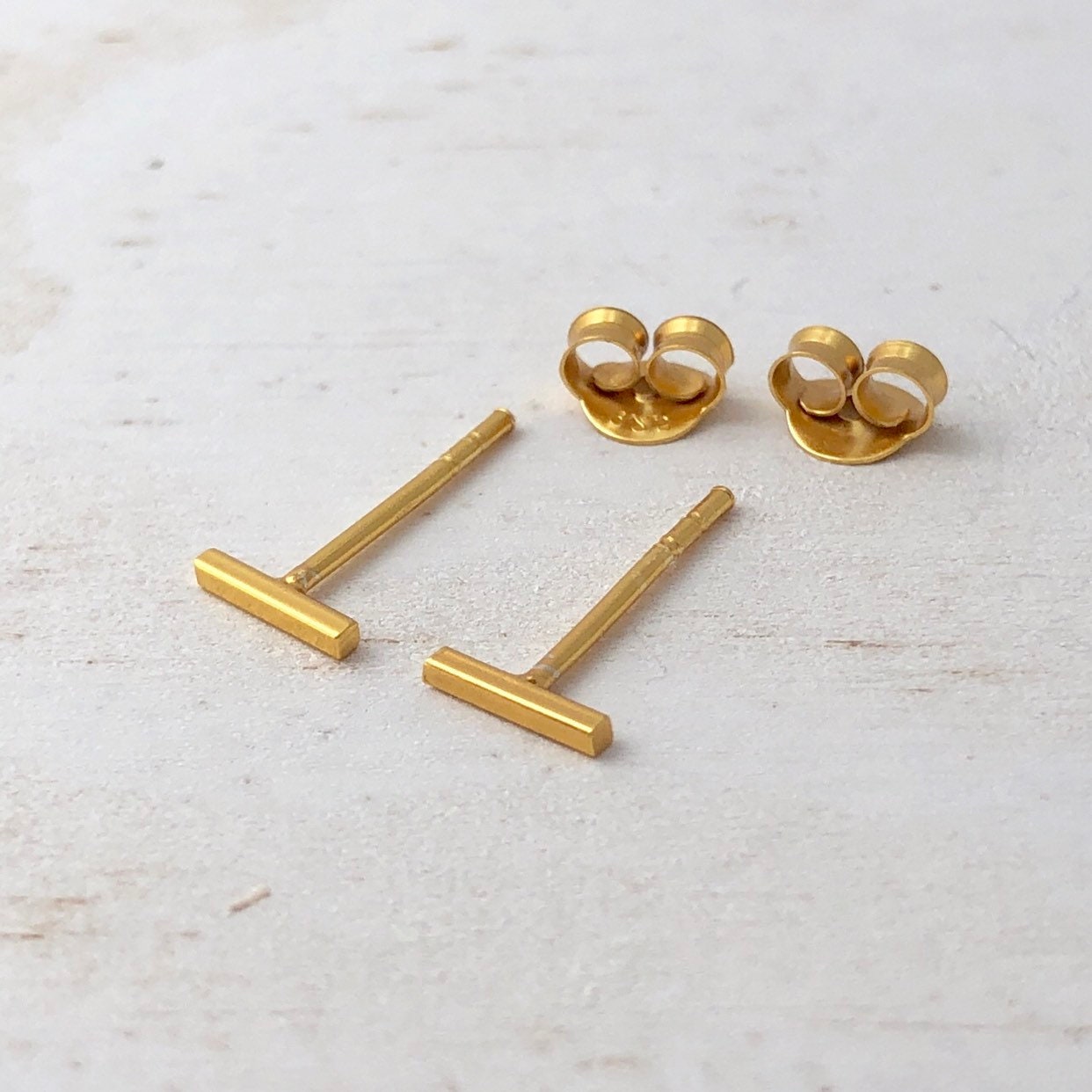 tiny bar earrings in gold