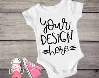 Download Free White Baby One piece Mockup, Bodysuit Mockup, Styled Stock Photography, Baby Mock Up, Flat Top View, Wood Background, Flat Lay, T shirt PSD Template