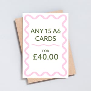 May include: A white card with pink wavy lines around the edges. The text "ANY 15 A6 CARDS FOR &pound;40.00" is written in green letters.