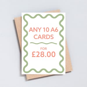 May include: A white card with a green wavy border. The text inside reads "ANY 10 A6 CARDS FOR &pound;28.00". The text is in a coral colour.