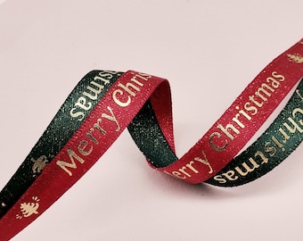 May include: Red and green ribbon with gold lettering that says "Merry Christmas".
