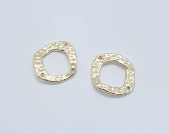 May include: Two gold-coloured, hammered-texture square-shaped jewellery components. Each component has an irregular, organic shape with two small holes for attachment. The components are displayed on a white background.