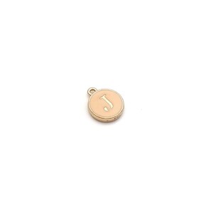 May include: Gold charm with a peach-colored enamel circle featuring the letter "J" in white.