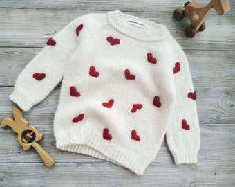 Custom knitted sweater with baby girl name on birthday. Personalized handmade alpaca wool pullover embroidered hearts for kids. Mumshugsknit