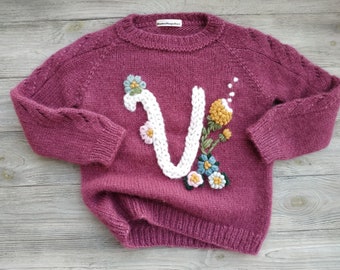 Handmade knitted sweater with name baby girl. Personalized wool warm pullover embroidery of flowers as birthday gift for kids. Mumshugsknit