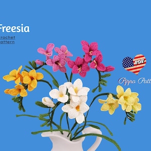 May include: A crochet pattern for a bouquet of freesia flowers in yellow, white, and pink. The pattern is available as a PDF download. The text "Freesia Crochet Pattern" and "Pippa Patterns" are visible in the image.