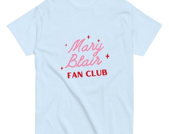May include: Light blue t-shirt with a pink and red graphic that says "Mary Blair Fan Club" with stars.