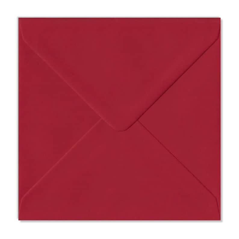 May include: A burgundy envelope with a pointed flap.