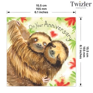 May include: A greeting card featuring a watercolor illustration of two sloths hugging each other. The card is white with green foliage and red flowers. The text "On Your Anniversary" is written in a cursive font.