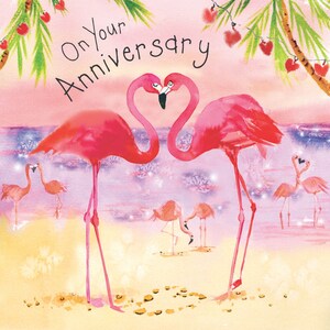 May include: Pink flamingo greeting card with the text "On Your Anniversary" and a watercolor illustration of two pink flamingos with their necks intertwined in a heart shape. The background is a soft pink and purple with a sparkling effect.