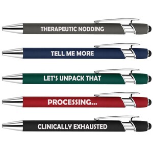 May include: A set of five retractable ballpoint pens with stylus tips, featuring silver-tone clips and tips. Each pen has a matte finish in gray, blue, green, red, or black, with white text reading THERAPEUTIC NODDING, TELL ME MORE, LET'S UNPACK THAT, PROCESSING..., or CLINICALLY EXHAUSTED.