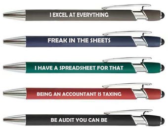 May include: A set of five retractable ballpoint pens with chrome accents and stylus tips. Each pen features a unique color barrel and white text: I EXCEL AT EVERYTHING, FREAK IN THE SHEETS, I HAVE A SPREADSHEET FOR THAT, BEING AN ACCOUNTANT IS TAXING, and BE AUDIT YOU CAN BE.