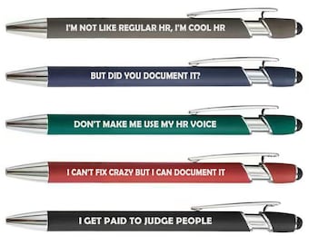 May include: A set of five retractable ballpoint pens in gray, blue, green, red, and black. Each pen features a silver clip, a stylus tip, and white text: I'M NOT LIKE REGULAR HR, I'M COOL HR; BUT DID YOU DOCUMENT IT?; DON'T MAKE ME USE MY HR VOICE; I CAN'T FIX CRAZY BUT I CAN DOCUMENT IT; I GET PAID TO JUDGE PEOPLE.