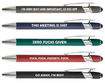 May include: A set of five retractable ballpoint pens with chrome accents and stylus tips. Each pen features a unique matte barrel color—gray, navy, teal, red, and black—and is printed with white text including phrases like I'M VERY BUSY AND IMPORTANT, SO PISS OFF, THIS MEETING IS SHIT, ZERO FUCKS GIVEN, FUCK. FUCK. FUCKETY. FUCK., and GO AWAY, I'M BUSY.