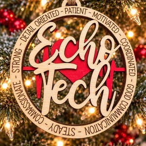 May include: A circular wooden ornament featuring the text Echo Tech in a script font layered over a red heart with an EKG line. The outer border is engraved with the words Patient, Motivated, Coordinated, Good Communication, Steady, Compassionate, Strong, and Detail Oriented.