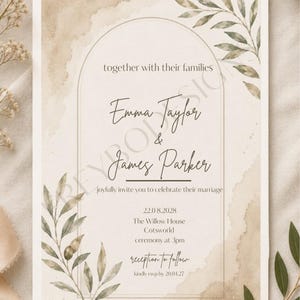 May include: A rectangular wedding invitation card featuring a beige watercolor wash background, a thin gold arch frame, and green olive branch illustrations. The text reads: together with their families, Emma Taylor & James Parker, joyfully invite you to celebrate their marriage, 22.08.2028, The Willow House, Cotsworld, ceremony at 3pm, reception to follow, kindly rsvp by 20.04.27.