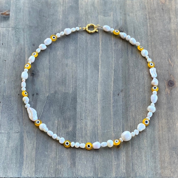 Harry styles evil eye necklace deals