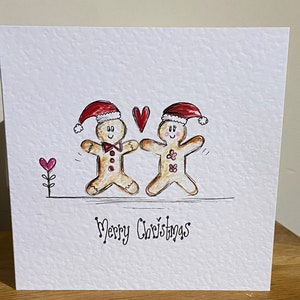 Hand gezeichnet handmade, um Lebkuchenpaar Weihnachtskarte zu bestellen. Kann personalisiert werden