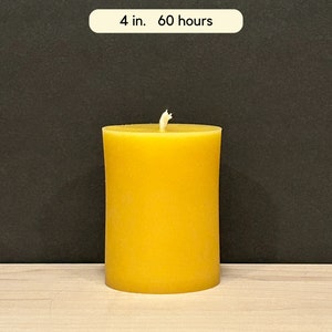 May include: A 4-inch diameter yellow beeswax candle with a burn time of 60 hours.