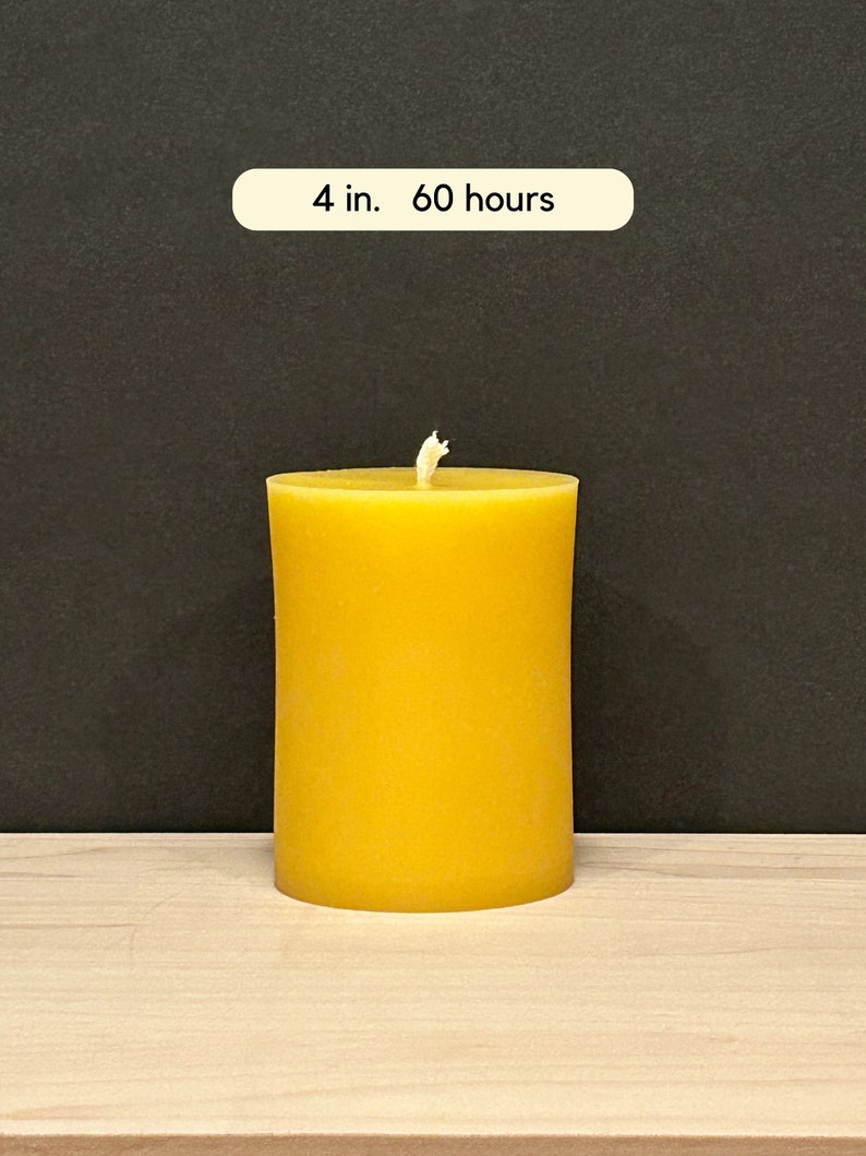 May include: A 4-inch diameter yellow beeswax candle with a burn time of 60 hours.