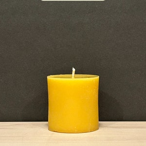 May include: A 3-inch diameter yellow beeswax candle with a burn time of 40 hours.