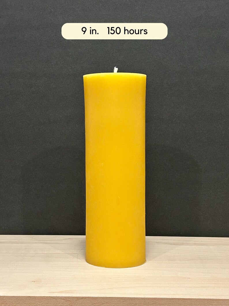 May include: A large, yellow, cylindrical candle with a white wick. The candle is 9 inches tall and has a burn time of 150 hours.
