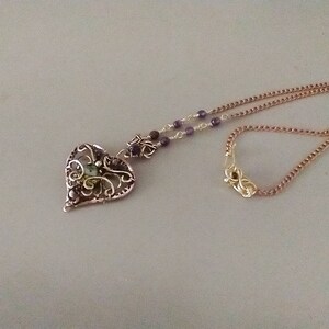 Brass and cubic zirconia heart pendant.