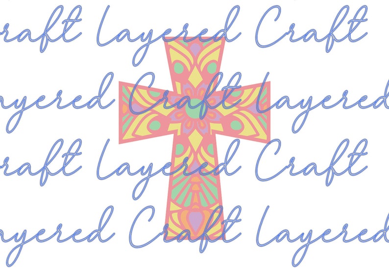 May include: A pink, yellow, and green mandala cross with a floral design. The cross is layered and has a multi-colored pattern.