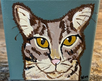 Tabby cat painting on canvas