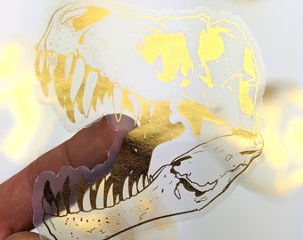 Pegatina de calavera de T-Rex dorada - Vinilo impermeable