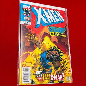 May include: A Marvel Comics X-Men issue number 92 comic book from September. The cover features the character Bishop with dreadlocks, wearing blue and gold armor, surrounded by yellow energy effects. The text reads X-Men, Bishop is back, and But is he the last X-Man?