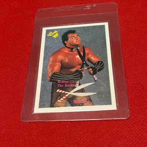 90s WWF Brutus The Barber #12 Classic WWF Wrestling Trading card (NM) Free Shipping! with a plastic sleeve and Card Saver case.Nice Gift