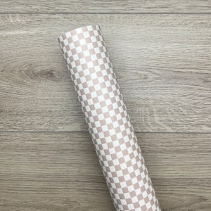 May include: A roll of white and light brown checkered wrapping paper.