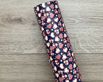 May include: A blue and red patterned fabric with white baseballs and hearts. The fabric is perfect for crafting projects.