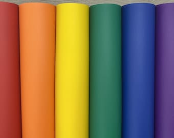 May include: Six rolls of faux leather in rainbow colors: red, orange, yellow, green, blue, and purple.