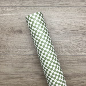 May include: A roll of green and white checkered wrapping paper.
