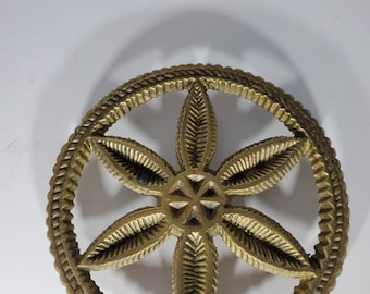 Antique brass trivet