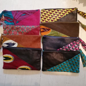 Pouch / case in soft and wax leather / trendy / Pompom
