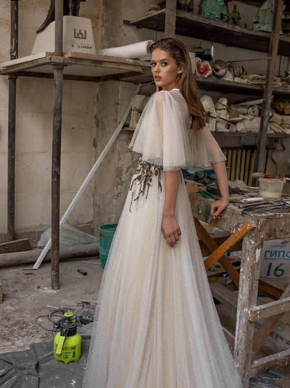 Robe de mariée manche chauve souris sale