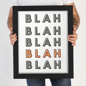 May include: A framed print with the word "BLAH" repeated five times in a black and white color scheme. The word "BLAH" in the middle is orange.