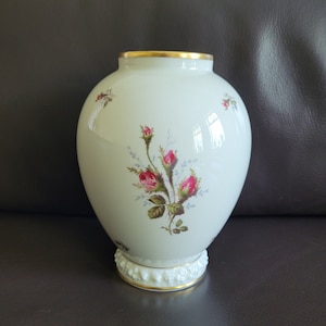 Vintage porcelain ivory colored vase with transfer of roses and gilt trim, marked Rosenthal and numbered 77