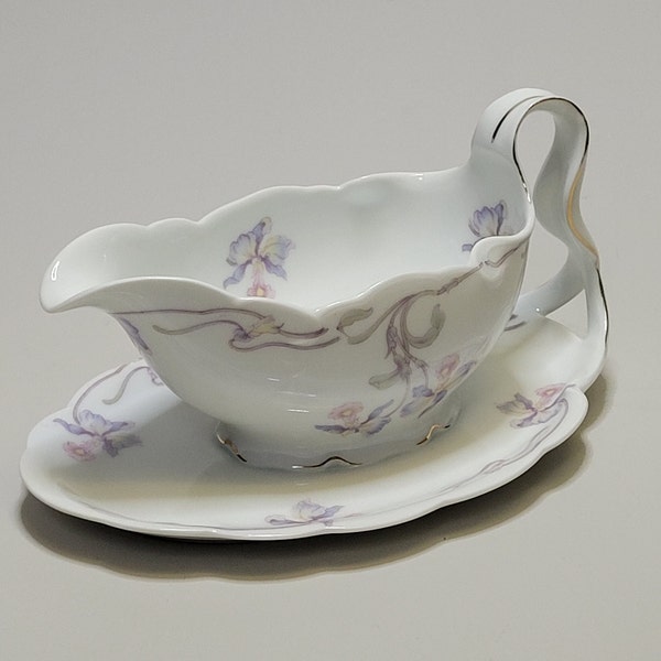 Antique porcelain Rosenthal gravy boat or sauce boat on plate with graceful handle, model Iris and pattern Orchid (1920)