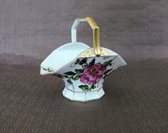 Antique Limoges porcelain basket with hand-painted bird and floral decoration signed by Irma Dignef