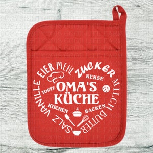 May include: Red oven mitt with a white circle design that says "Oma's K&uuml;che" with German words for baking ingredients around the circle.