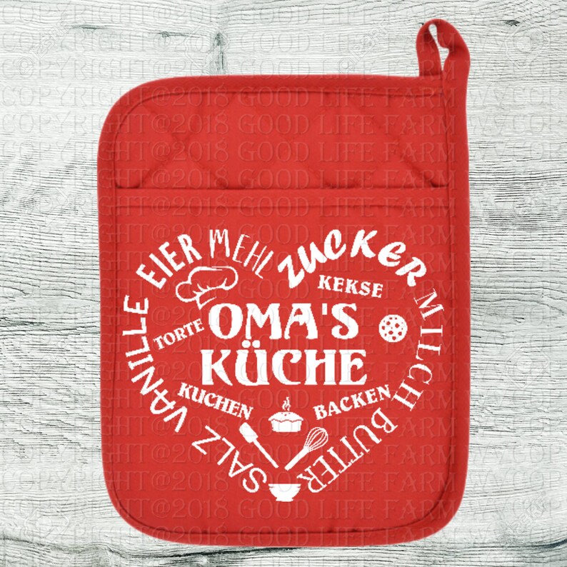 May include: Red oven mitt with a white circle design that says "Oma's K&uuml;che" with German words for baking ingredients around the circle.