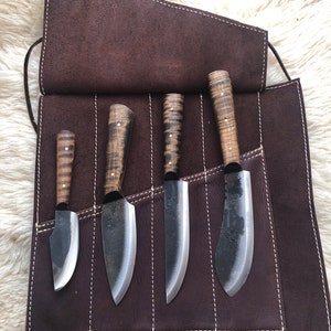 Woodsman’s Collection: Hunter’s knife roll with Jeff White knives, Nessmuk Skinning, English trade, Bush 1, and thumb Skinner